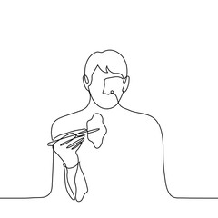 silhouette of a man eating with chopsticks - one line drawing vector. man eating in Asian style, he is holding a piece of food with chopsticks