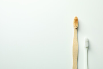 Eco friendly wooden toothbrushes on white background