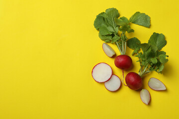 Fresh radish on yellow background, space for text