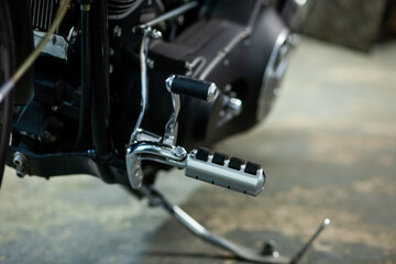 chrome steel foot of motorcycle.