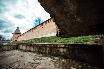 an old dried-up pond in mud and garbage. an abandoned park near the old fortress. desolation in the city of a poor country. the stone bowl of the fountain needs to be repaired. a torn shoe lies