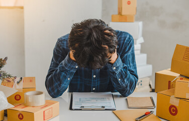 Stress online seller working with calculator while sitting on the table at home. Small Medium Enterprise or Start up concept