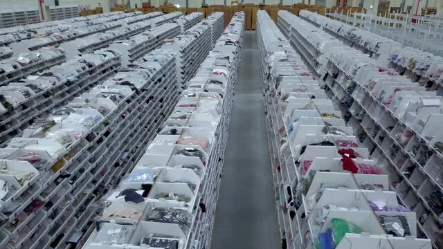 shelves full of clothes in a logistics center