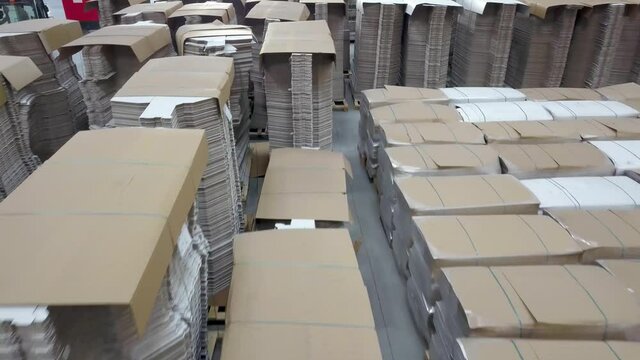  pallets of cardboard boxes stacked in a warehouse