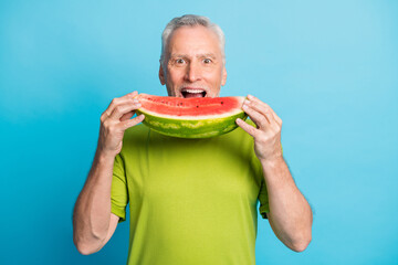 Photo of positive aged man arms hold slice of watermelon open mouth isolated on blue color background - obrazy, fototapety, plakaty