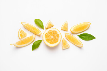 Flat lay composition with juicy lemon slices and green leaves on white background