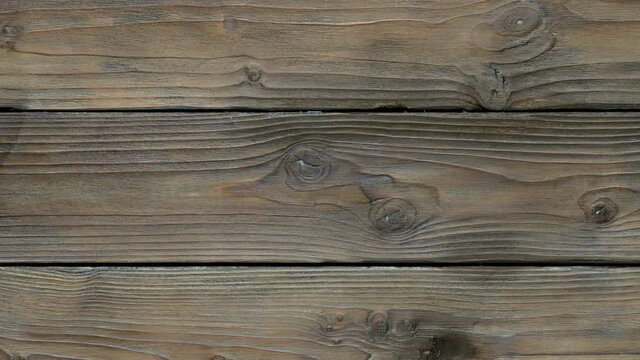 Old wood texture with knots move from right to left.