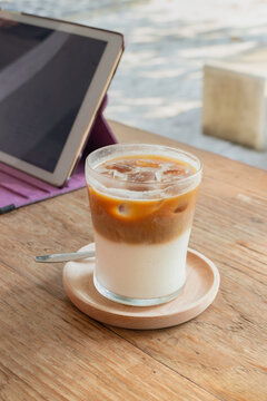 Morning coffee latte on wood desk work from home office