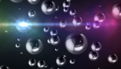 Abstract background. Chrome spheres of different sizes on a dark background