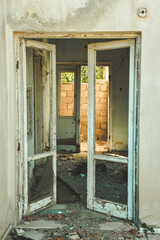 an old abandoned, demolished house with window and door. Vintage destroyed home. 
