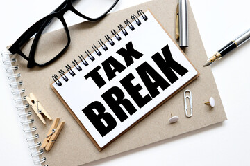 tax break. notepad on notepad, text on white notepad on white background