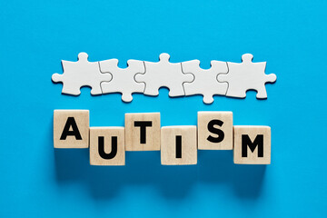 ASD or autism spectrum disorder. The word autism on wooden cubes