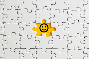 Smiling happy face icon on missing puzzle piece. Customer or client satisfaction