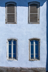 Blue stucco house in the town of Mirepoix, France.