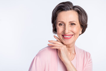 Photo of aged cheerful woman grandmother happy positive smile look empty space isolated over grey color background