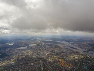 Obraz premium The city of Kiev in cloudy weather. Aerial high view.