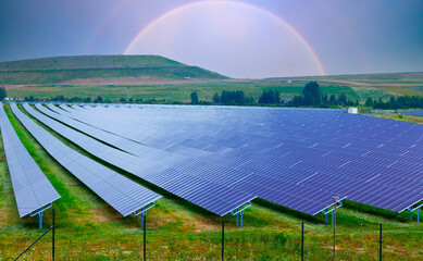 Farm with solar electric panels on a green field