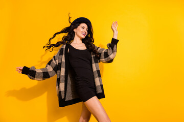 Photo of inspired dreamy lady look empty space wear black headwear plaid coat isolated yellow color background