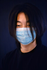 Handsome Asian boy wearing face mask 