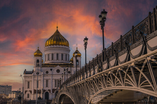 Cathedral of Christ the Savior in Moscow, Russia, with sunset light and bridge over the moscova river