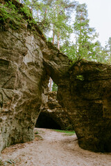 The Devil's Oven. The only natural sandstone with arches in Latvia in Liepa parish. Vintage filter.