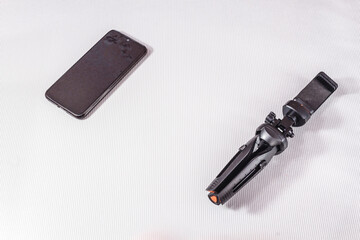 Modern gadgets for communication, photo and video filming on a light background.