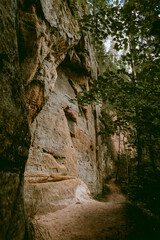 Hiking trail by the Licu and Langu sandstone cliffs by the Gauja river in Latvia
