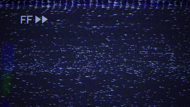 Rewind FF sign, arrows marks, VHS noise texture. Static noise, glitch effect. Videocassette recorder. Damaged cassette  type, bad signal. TV noise. Retro, vintage 90s style animation. Seamless loop 4K