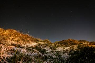 Sandy dunes with the stars at the night near Bowleaze cove on Weymouth beach, Dorset UK