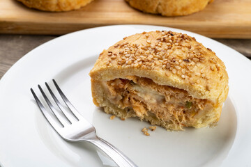 Homemade stuffed chicken pie over white plate