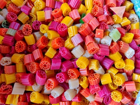 Colourful Far-far, fryum, bobby, is an Indian snack food composed primarily of potato starch and tinted sago.