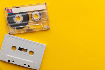 vintage white cassette tape on a bright yellow background