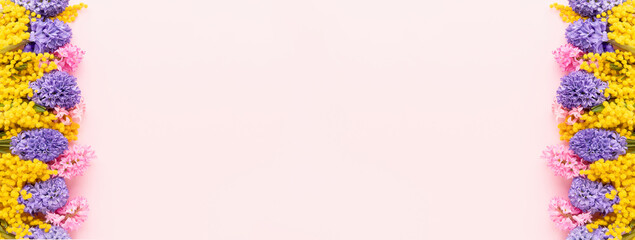 Mimosa and hyacinth flowers banner on a pink background. Mothers Day, Valentines Day concept.