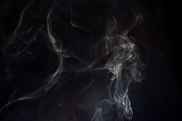 cloud of white smoke on black background