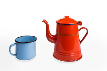 Old vintage enamel teapot and cup