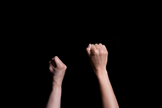 Closeup shot of two female hand punche - concept of abuse