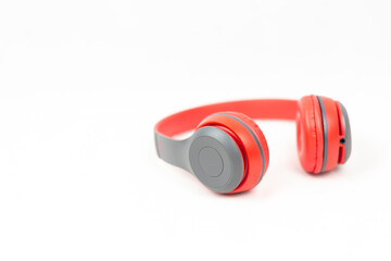Headphone red color with copy space isolated on white background.
