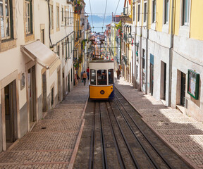 Lisbon. Old yellow traditional city tram on a sunny morning.