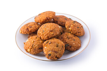lentil fritters, savoury fried snack also called dal vada, wada or vadai in south east asia, deep fried vegetarian food