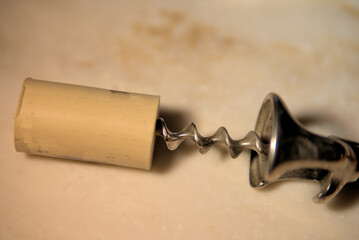 Spiral wine cork remover and the cork it removed.
