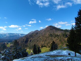Mountain range at Hlevnska planina in the hills of Idrija in Littoral region, Slovenia covered in forest and Golaki mountains
