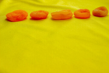 Falling dried apricots isolated on white background with clipping path