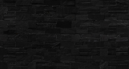 Seamless black brick wall texture for background.