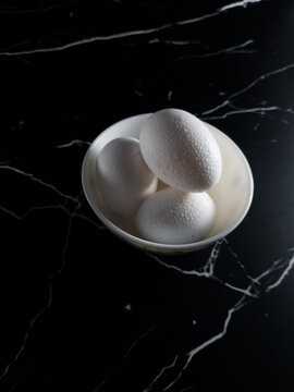 Eggs in a bowl dark background 