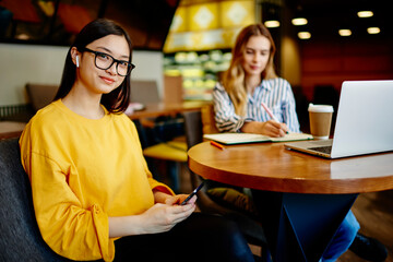Female friends spending time in cafe