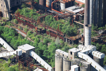 An aerial view, taken from a helicopter, of a derelict and abandoned industrial colliery site in...
