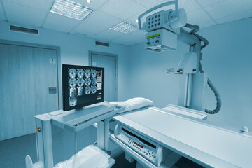 X-ray room of a hospital with its computer and stretcher for the patient