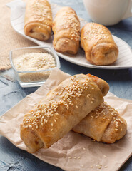 Cabbage pies. Puff pastry sprinkled with sesame seeds. Puff pastry with cabbage.