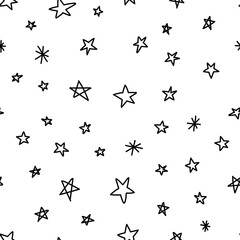 Hand drawn stars seamless pattern. Monochrome texture background of star doodle illustrations.