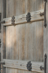 Close-up of old wooden doors. Cracked wood material structure. Selective focus. Byeongsan Seowon, Andong, South Korea.